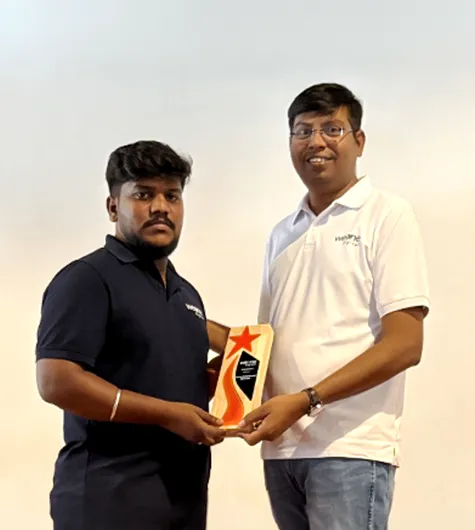 Rubesh receiving Best Performance Award 2025